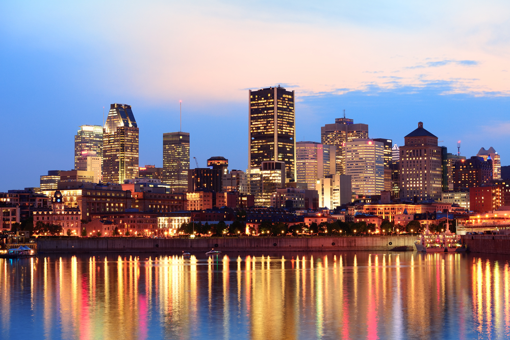 Montreal,Over,River,At,Sunset,With,City,Lights,And,Urban